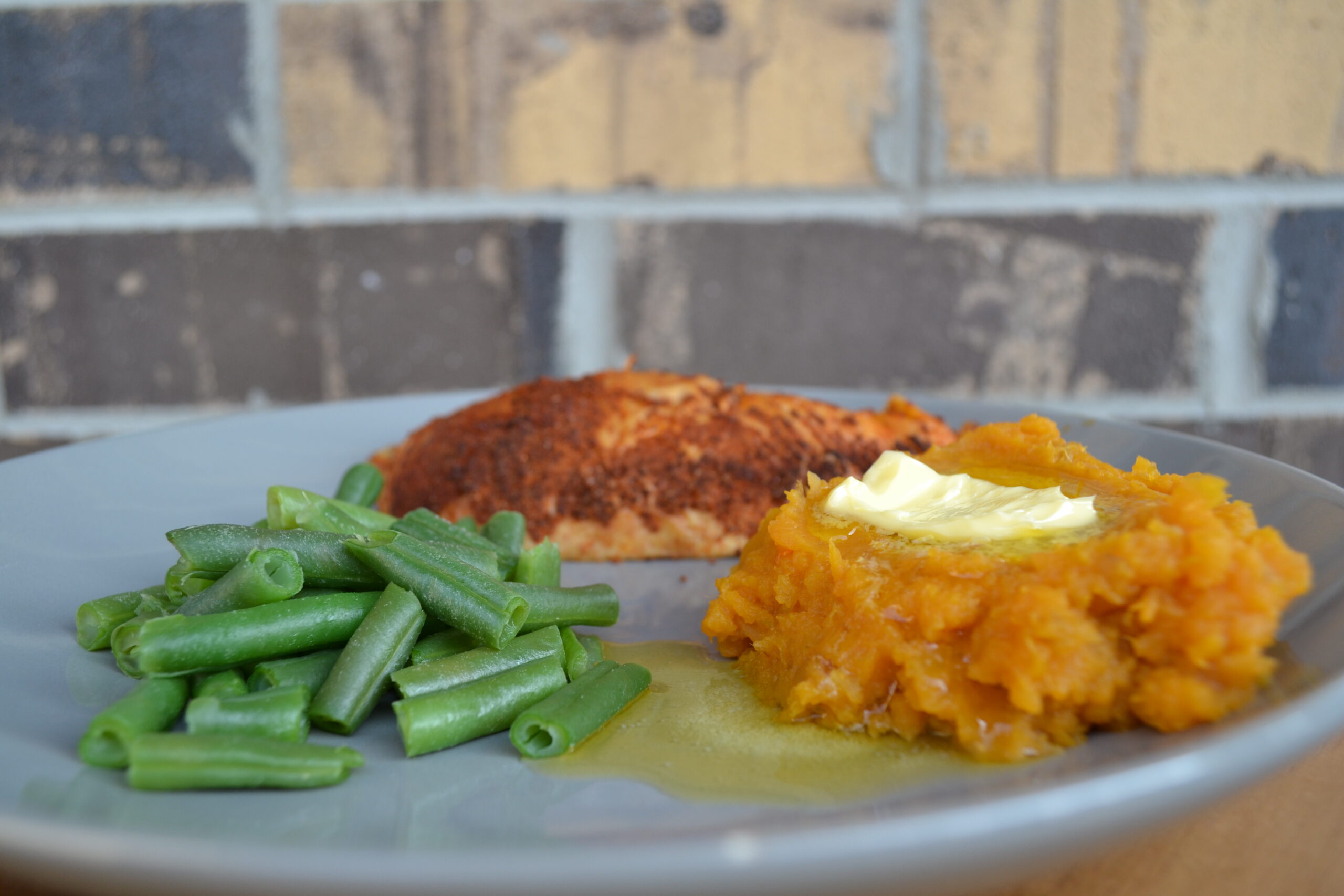 Plate of chicken, green beans and sweet potato