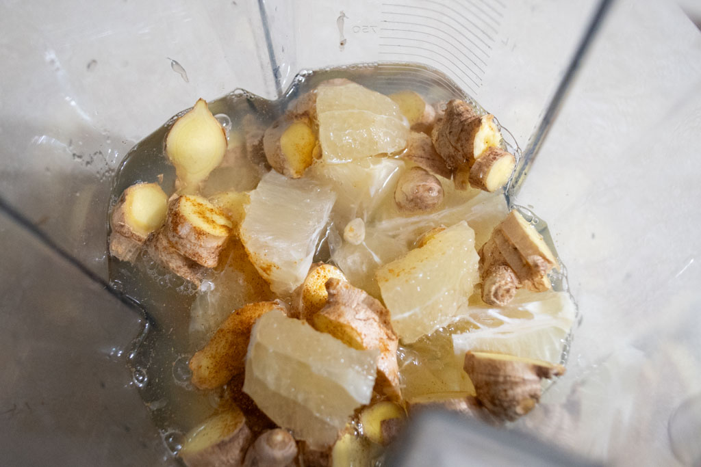 Cut lemons, sliced ginger and water in a Vitamix blender